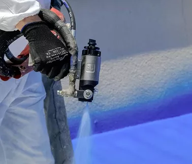Application of heavy-duty elastomeric polyurea coating on a concrete industrial substrate.